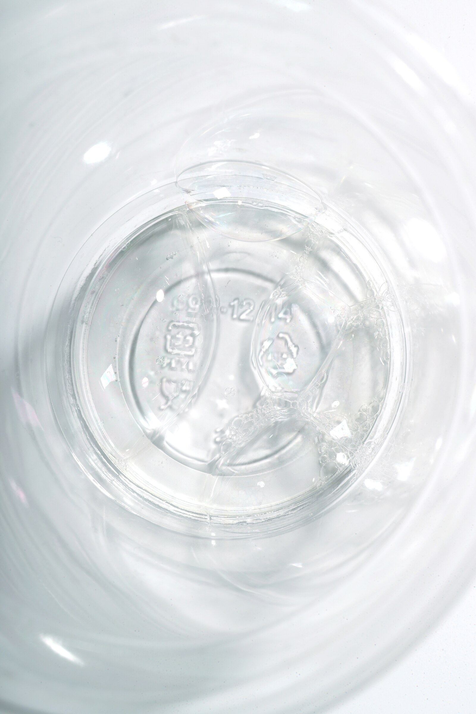 Circular transparent form photographed in pale refracted light