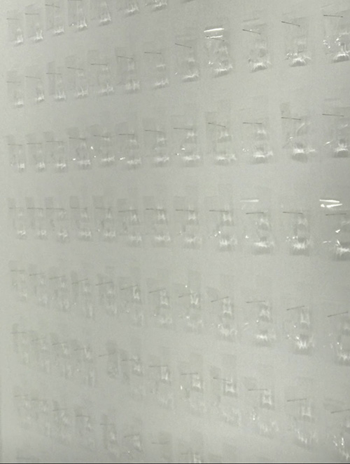 Detail of transparent wall-mounted elements in a light installation